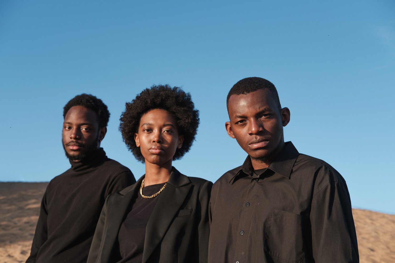 Three Diverse People in Black Outfit Outdoors