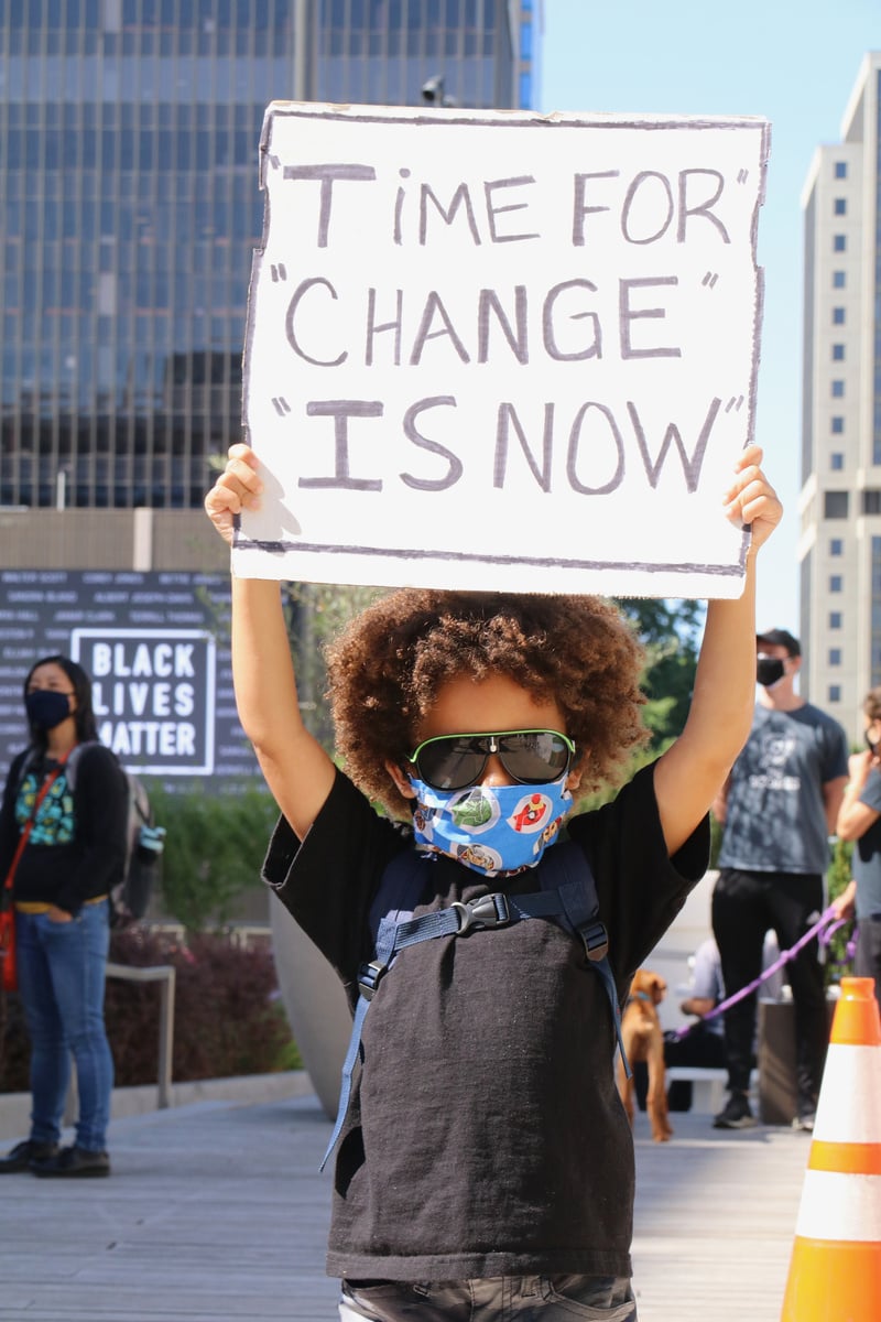 Young Boy with Placard