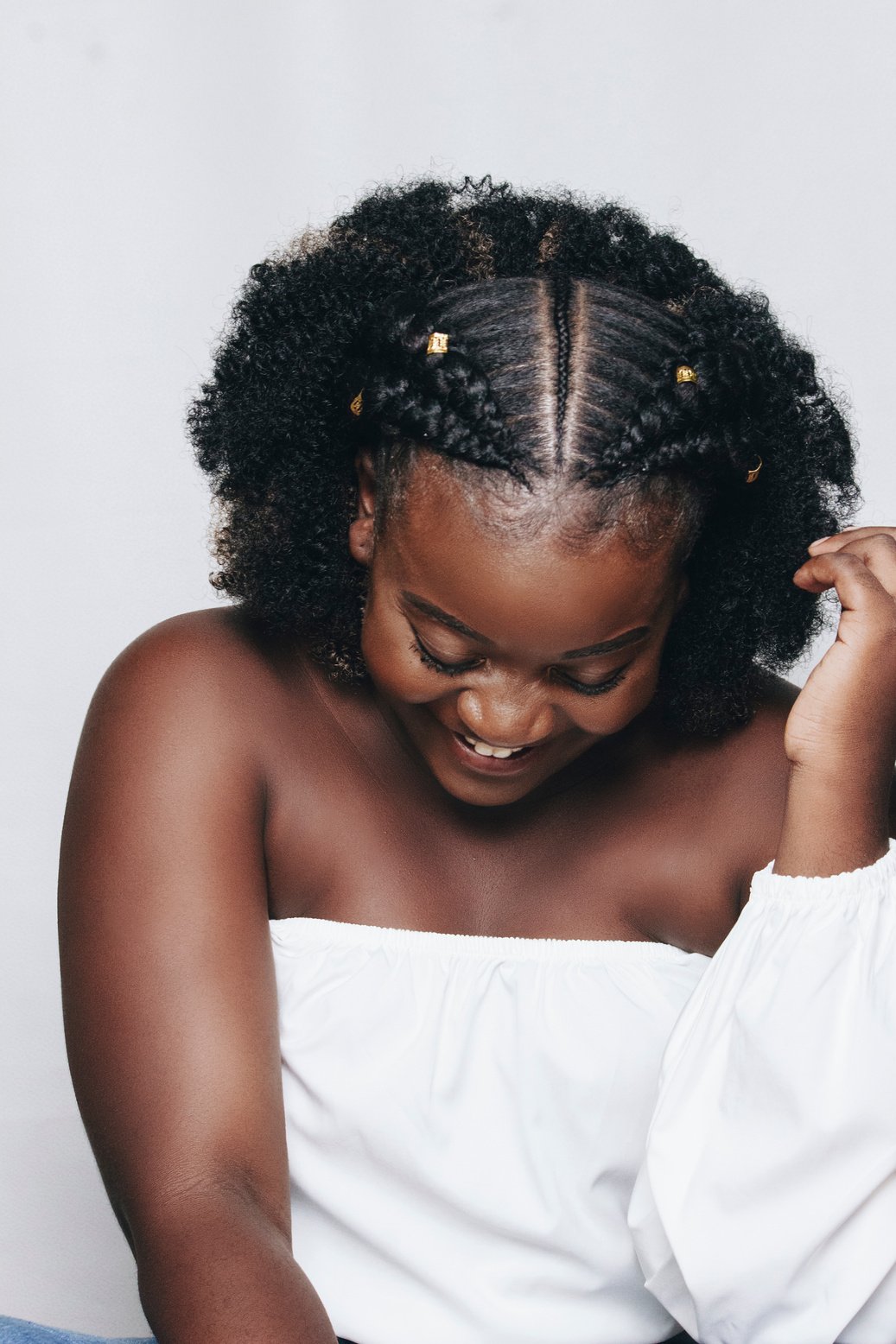 Portrait of a Smiling Woman with Black Hair in Braids