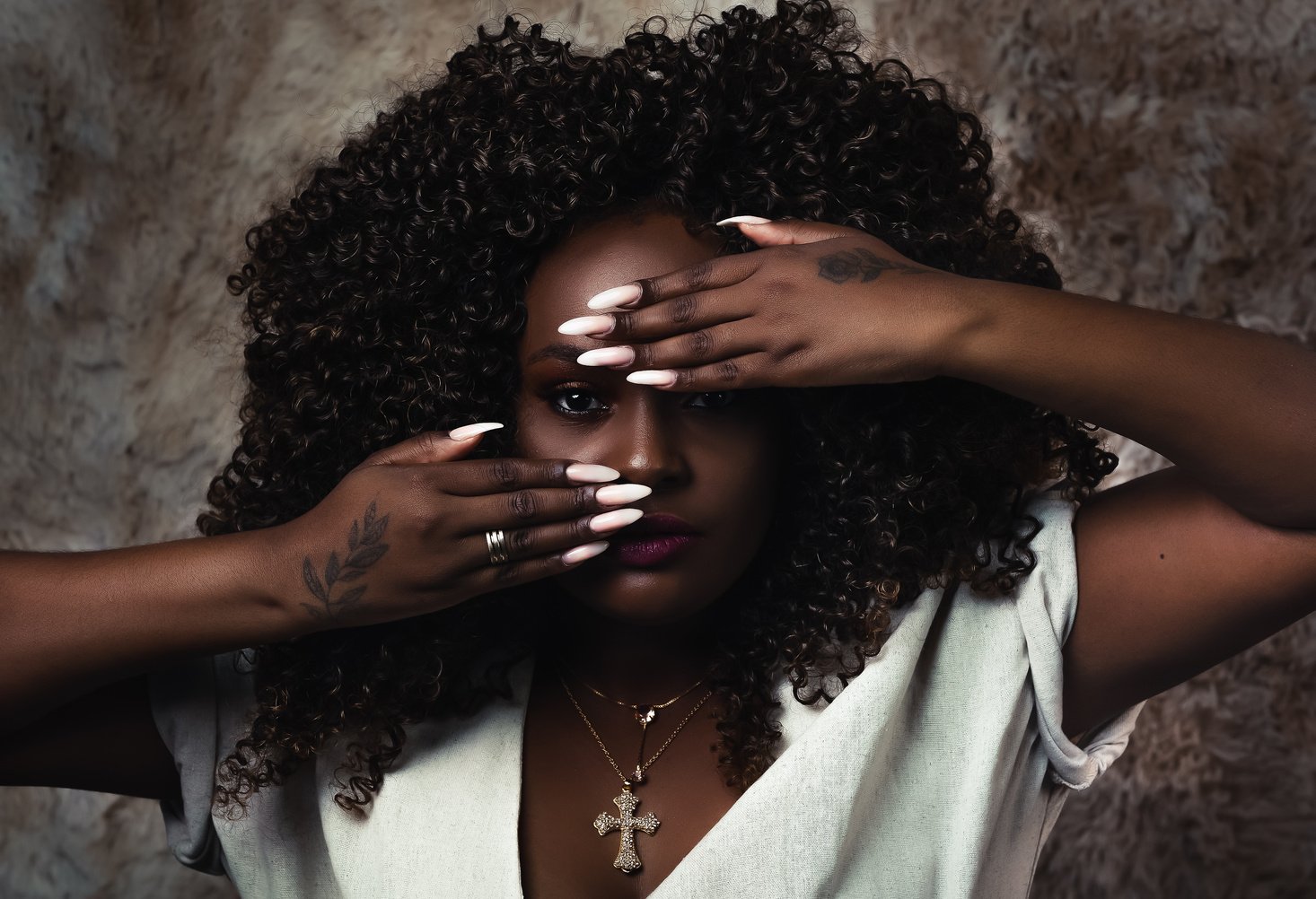 Woman In White Shirt Covering Her Face With Her Hand